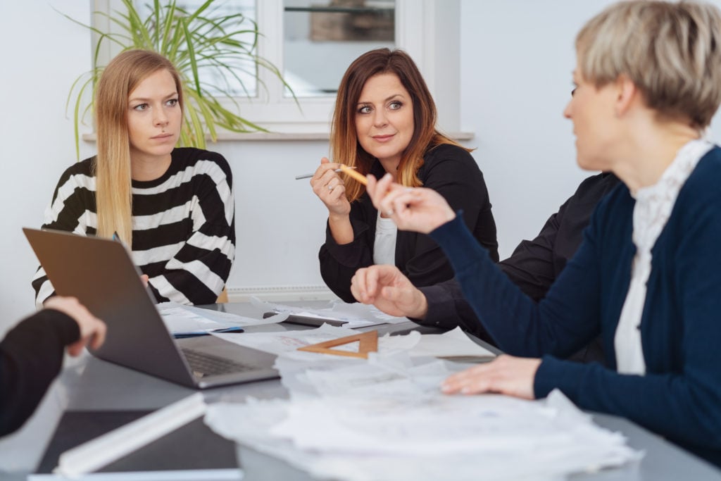 teachers chatting at a table